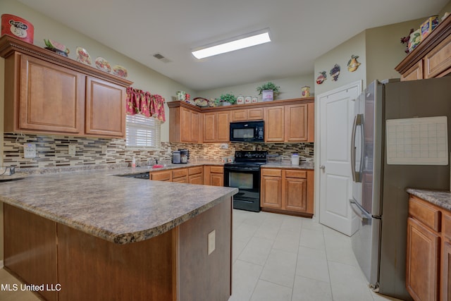 kitchen with decorative backsplash, light tile patterned floors, kitchen peninsula, and black appliances