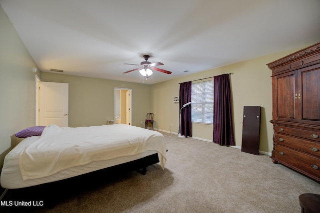 bedroom with light carpet and ceiling fan