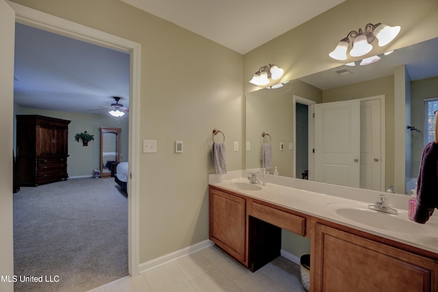 bathroom featuring tile patterned floors, ceiling fan, and vanity