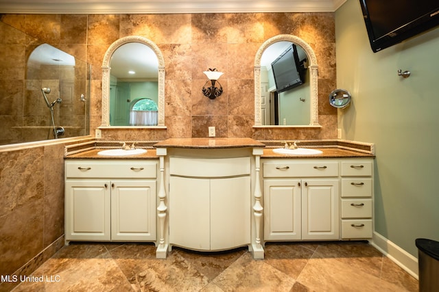 6147 Wirtz Rd, Flowood, MS 39232 - bathroom with double vanity, walk in shower, tile walls, and ornamental molding