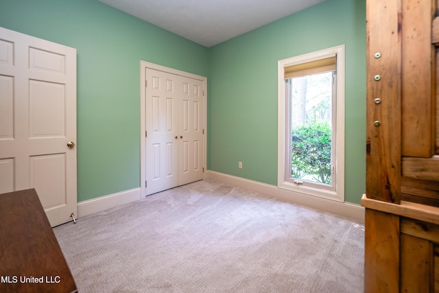 6147 Wirtz Rd, Flowood, MS 39232 - unfurnished bedroom featuring light carpet and a closet