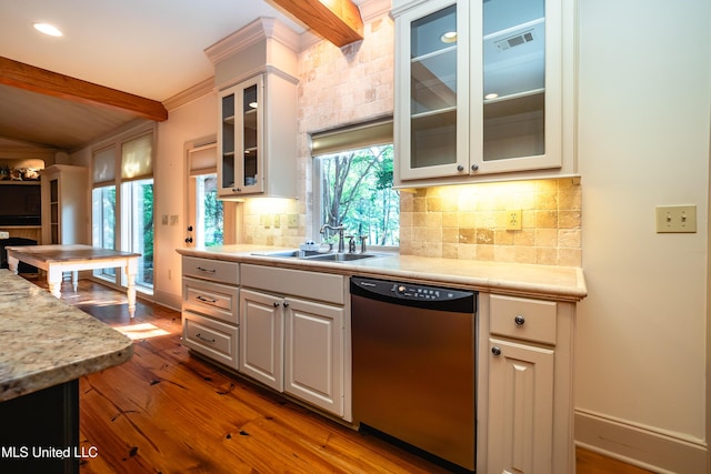6147 Wirtz Rd, Flowood, MS 39232 - kitchen featuring dishwasher, wood finished floors, light countertops, decorative backsplash, and glass insert cabinets