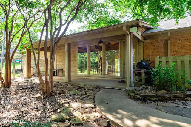 6147 Wirtz Rd, Flowood, MS 39232 - doorway to property with a patio, brick siding, and roof with shingles
