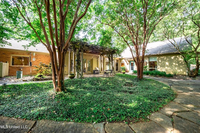 6147 Wirtz Rd, Flowood, MS 39232 - rear view of property featuring a pergola and a patio