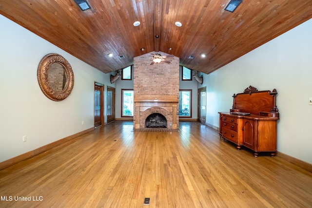 6147 Wirtz Rd, Flowood, MS 39232 - unfurnished living room featuring vaulted ceiling, light wood-type flooring, a brick fireplace, recessed lighting, and wooden ceiling