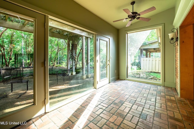 6147 Wirtz Rd, Flowood, MS 39232 - entryway featuring a ceiling fan, vaulted ceiling, and brick floors
