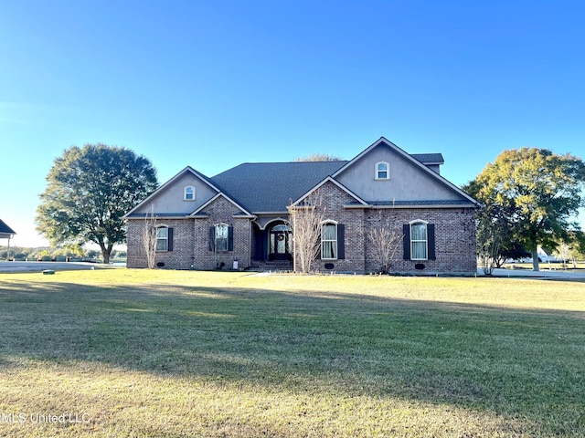 view of front of home with a front yard