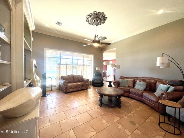 living room featuring ceiling fan and ornamental molding