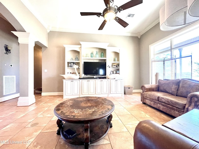 tiled living room featuring built in features, ornamental molding, and decorative columns