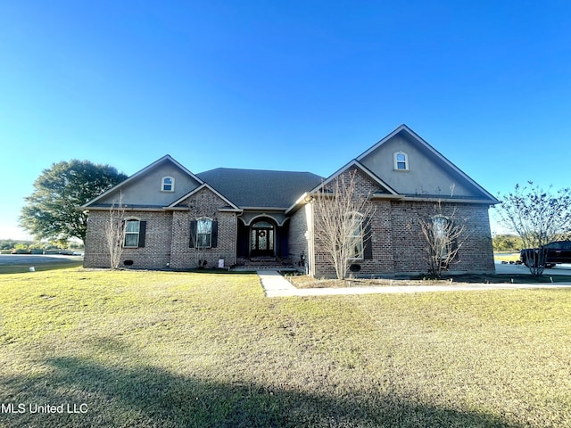 view of front of home with a front yard