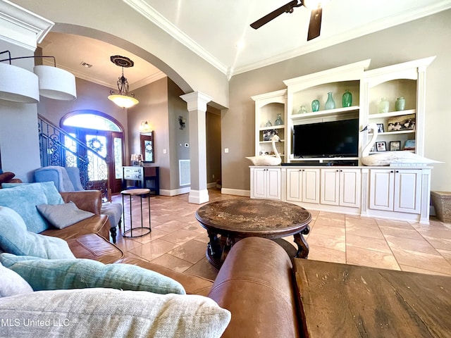 living room featuring decorative columns, built in shelves, ceiling fan, and ornamental molding