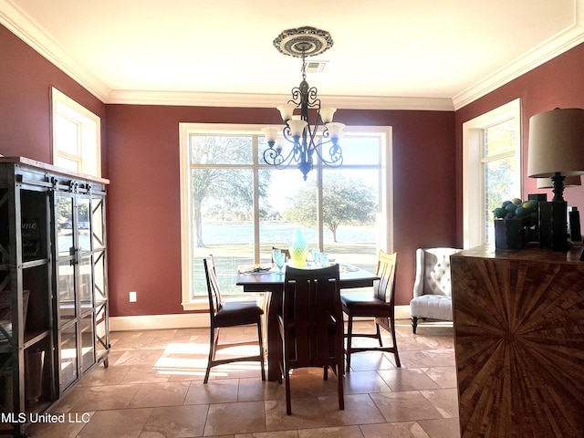 dining room featuring a healthy amount of sunlight, crown molding, and an inviting chandelier