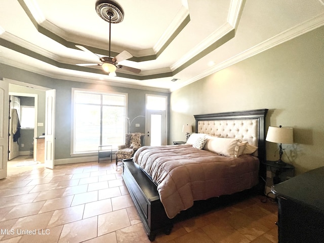 bedroom with a raised ceiling, ceiling fan, and ornamental molding