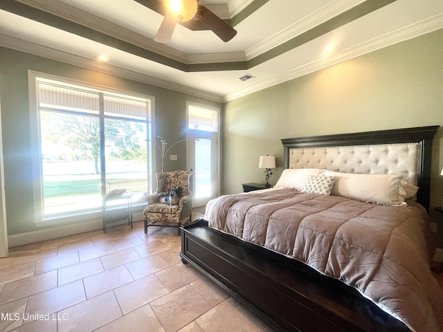 tiled bedroom with ceiling fan, crown molding, and a tray ceiling