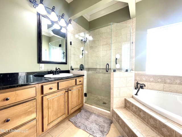 bathroom with plus walk in shower, tile patterned flooring, vanity, and ornamental molding