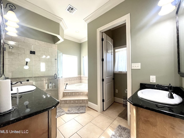 bathroom featuring plus walk in shower, tile patterned flooring, vanity, and a healthy amount of sunlight