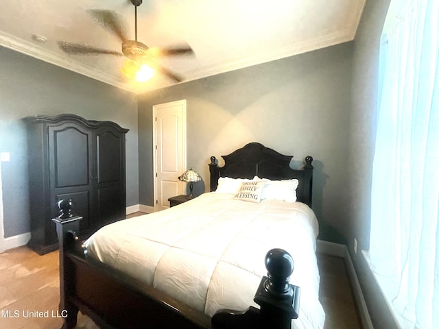 bedroom featuring ceiling fan, carpet, and ornamental molding