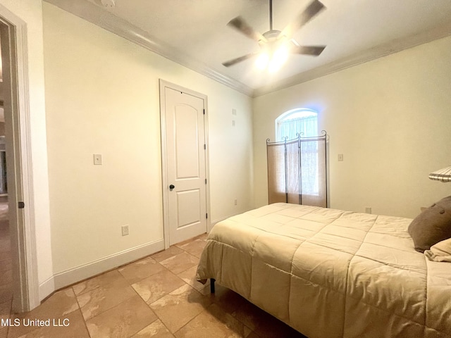 bedroom featuring ceiling fan and crown molding