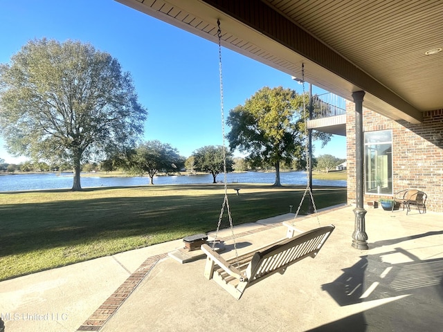 view of patio with a water view