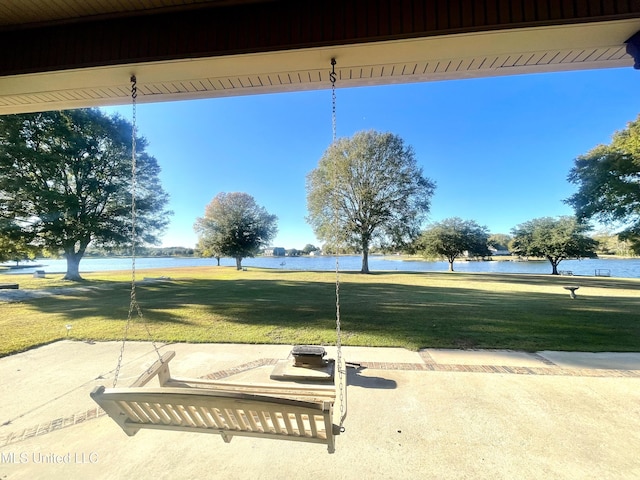 exterior space featuring a yard and a water view