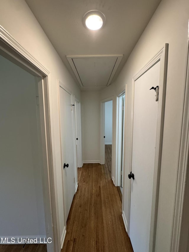 1597 Vicksburg Dr, Southaven, MS 38671 - hall with attic access, dark wood-type flooring, and baseboards