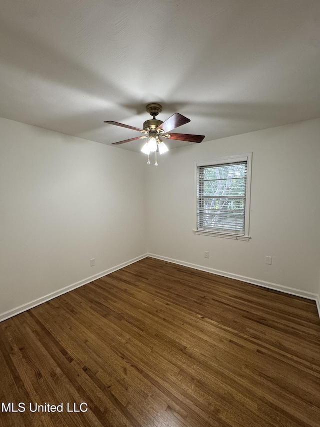 1597 Vicksburg Dr, Southaven, MS 38671 - unfurnished room with ceiling fan, baseboards, and dark wood finished floors