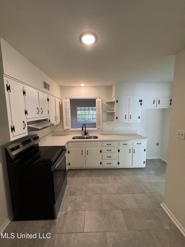 1597 Vicksburg Dr, Southaven, MS 38671 - kitchen with stainless steel range with electric cooktop, a sink, white cabinetry, and baseboards