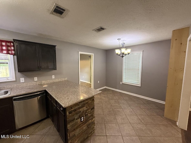 22090 Rayvan Ln, Kiln, MS 39556 - kitchen with dishwasher, a peninsula, light tile patterned flooring, a chandelier, and a textured ceiling