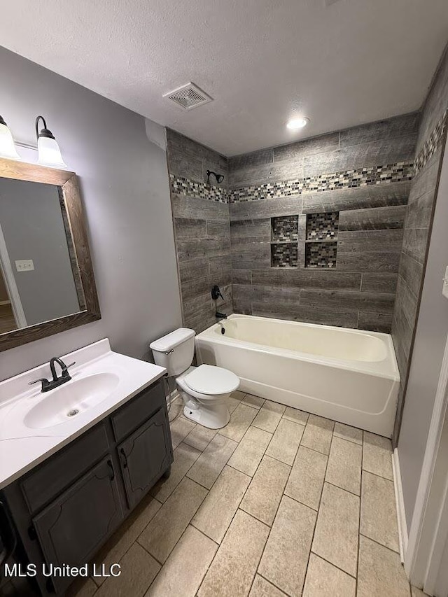 22090 Rayvan Ln, Kiln, MS 39556 - full bathroom with vanity, shower / tub combination, tile patterned flooring, and a textured ceiling