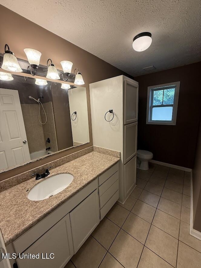 22090 Rayvan Ln, Kiln, MS 39556 - full bath with vanity, tile patterned floors, a textured ceiling, and shower / tub combination