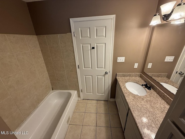 22090 Rayvan Ln, Kiln, MS 39556 - full bathroom featuring vanity, tile patterned floors, and a tub