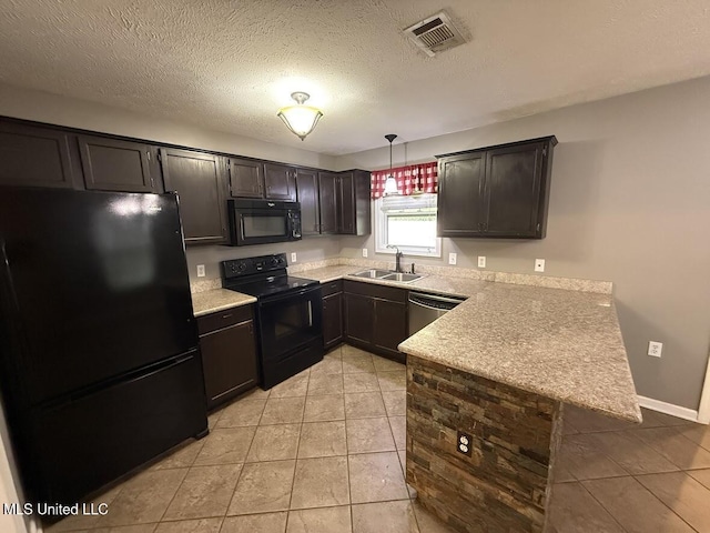 22090 Rayvan Ln, Kiln, MS 39556 - kitchen with black appliances, a peninsula, light countertops, light tile patterned floors, and pendant lighting