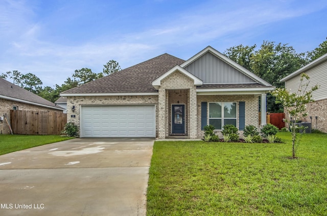 craftsman inspired home with fence, driveway, an attached garage, a front lawn, and brick siding