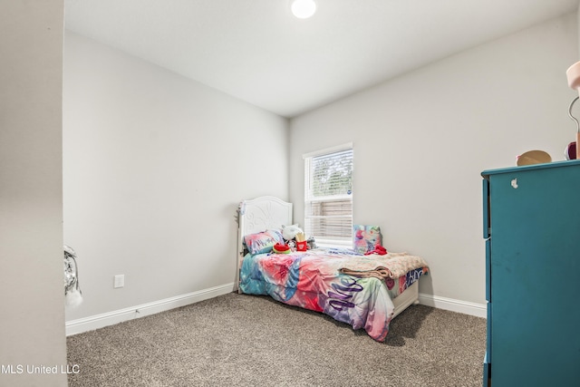 bedroom with carpet flooring and baseboards