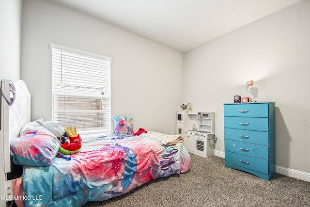 bedroom featuring carpet flooring and baseboards