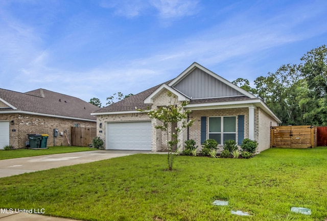 view of front of home featuring a front yard, fence, driveway, an attached garage, and brick siding