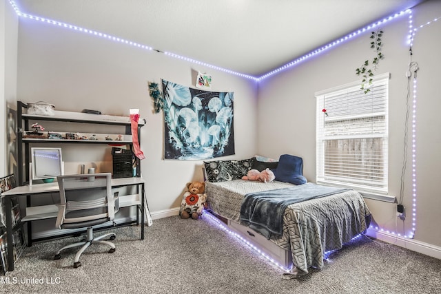 carpeted bedroom with baseboards