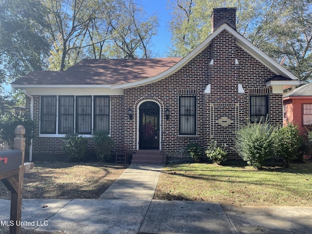 view of front of home with a front yard