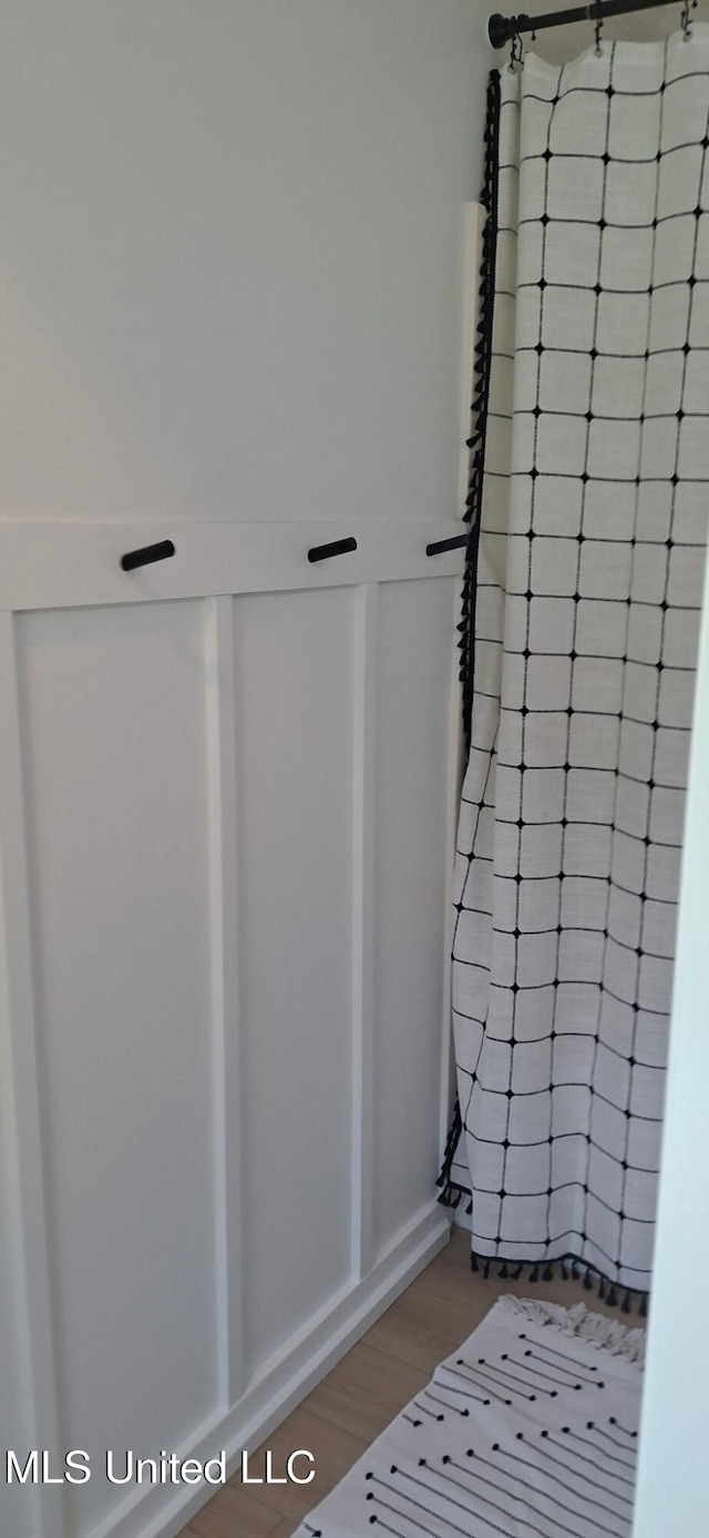 909 Sears Ave, Waveland, MS 39576 - full bath featuring wood finished floors and a shower
