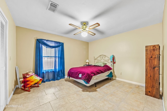 bedroom with light tile patterned floors and ceiling fan