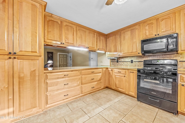 kitchen featuring light tile patterned floors, backsplash, ceiling fan, and black appliances