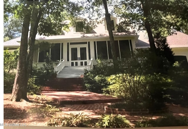 back of property featuring a sunroom