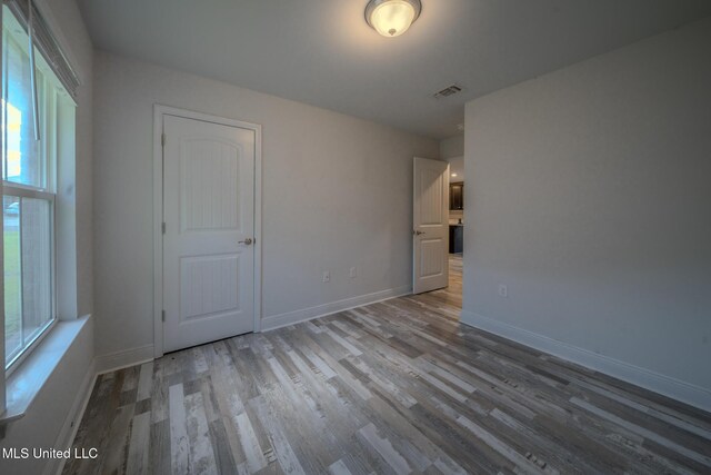 13724 Fox Hill Dr, Gulfport, MS 39503 - empty room featuring wood finished floors and baseboards