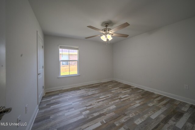 13724 Fox Hill Dr, Gulfport, MS 39503 - unfurnished room featuring wood finished floors, a ceiling fan, and baseboards