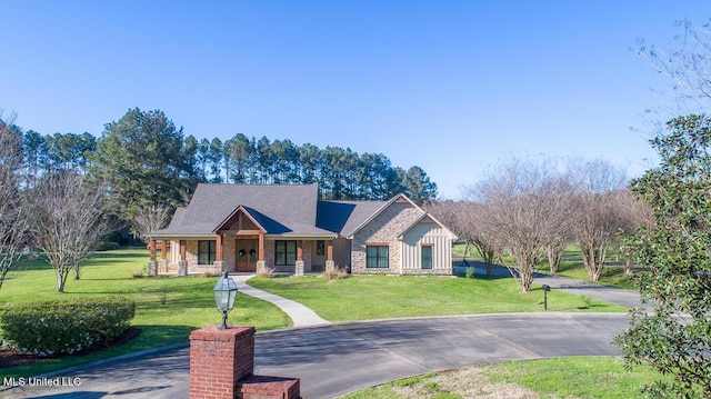 29 Club Dr, Natchez, MS 39120 - view of front of home with stone siding and a front yard