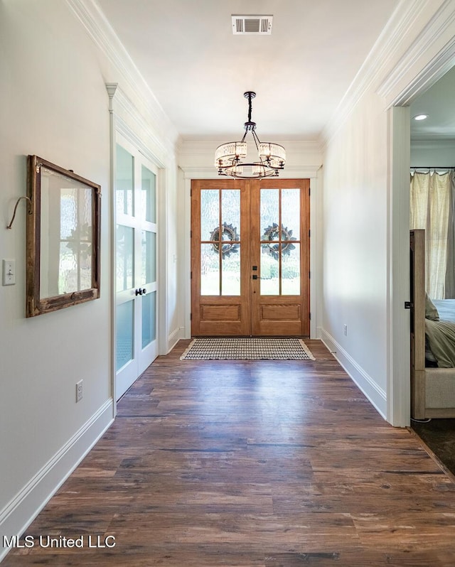 29 Club Dr, Natchez, MS 39120 - interior space featuring french doors, a chandelier, visible vents, ornamental molding, and dark wood-type flooring