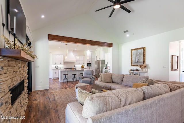 29 Club Dr, Natchez, MS 39120 - living area with dark wood-style flooring, high vaulted ceiling, visible vents, a fireplace, and ceiling fan