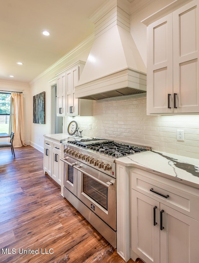 29 Club Dr, Natchez, MS 39120 - kitchen with ornamental molding, wood finished floors, range with two ovens, and premium range hood
