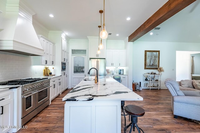 29 Club Dr, Natchez, MS 39120 - kitchen with a breakfast bar area, premium appliances, premium range hood, open floor plan, and dark wood-style flooring
