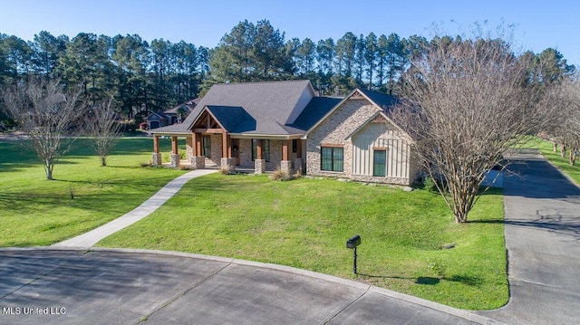 29 Club Dr, Natchez, MS 39120 - view of front of home with stone siding, driveway, and a front yard